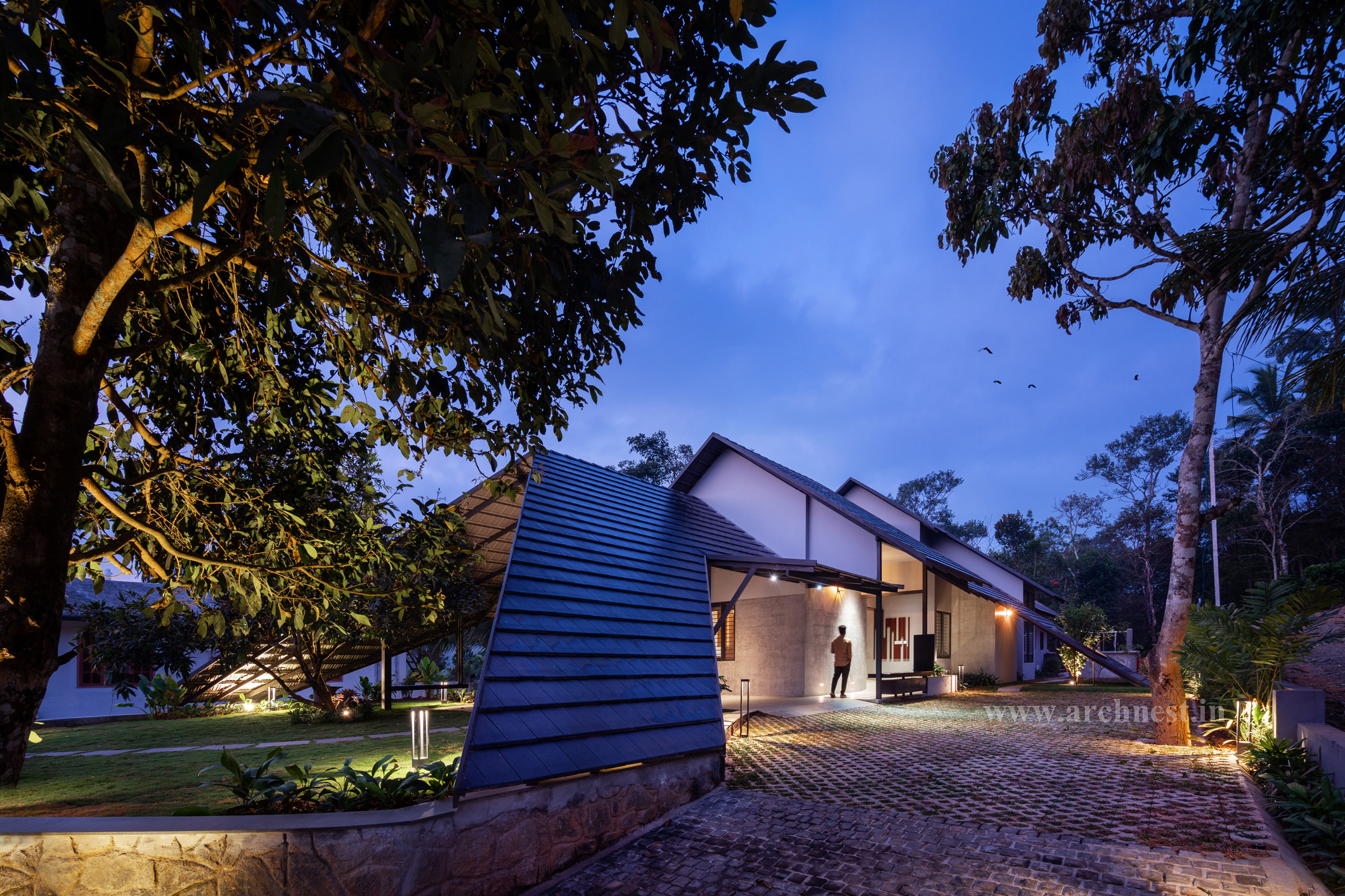 The tiled roof comes down and touches the ground